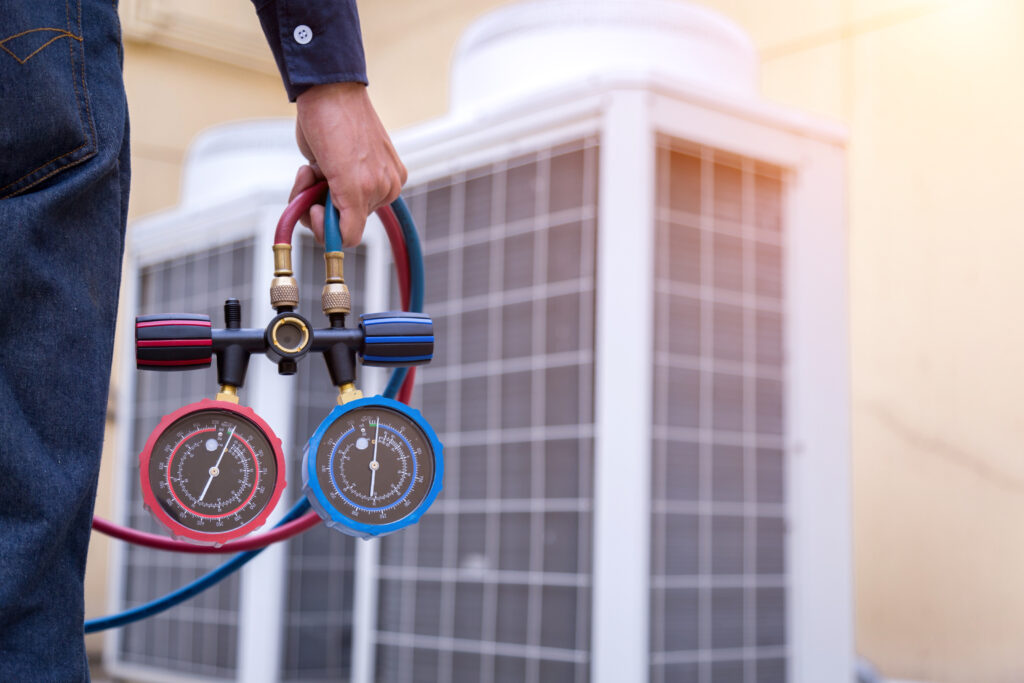technician-is-checking-air-conditioner-measuring-equipment-filling-air-conditioners