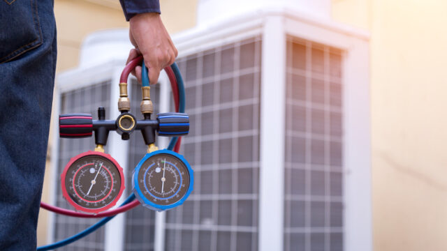 technician-is-checking-air-conditioner-measuring-equipment-filling-air-conditioners